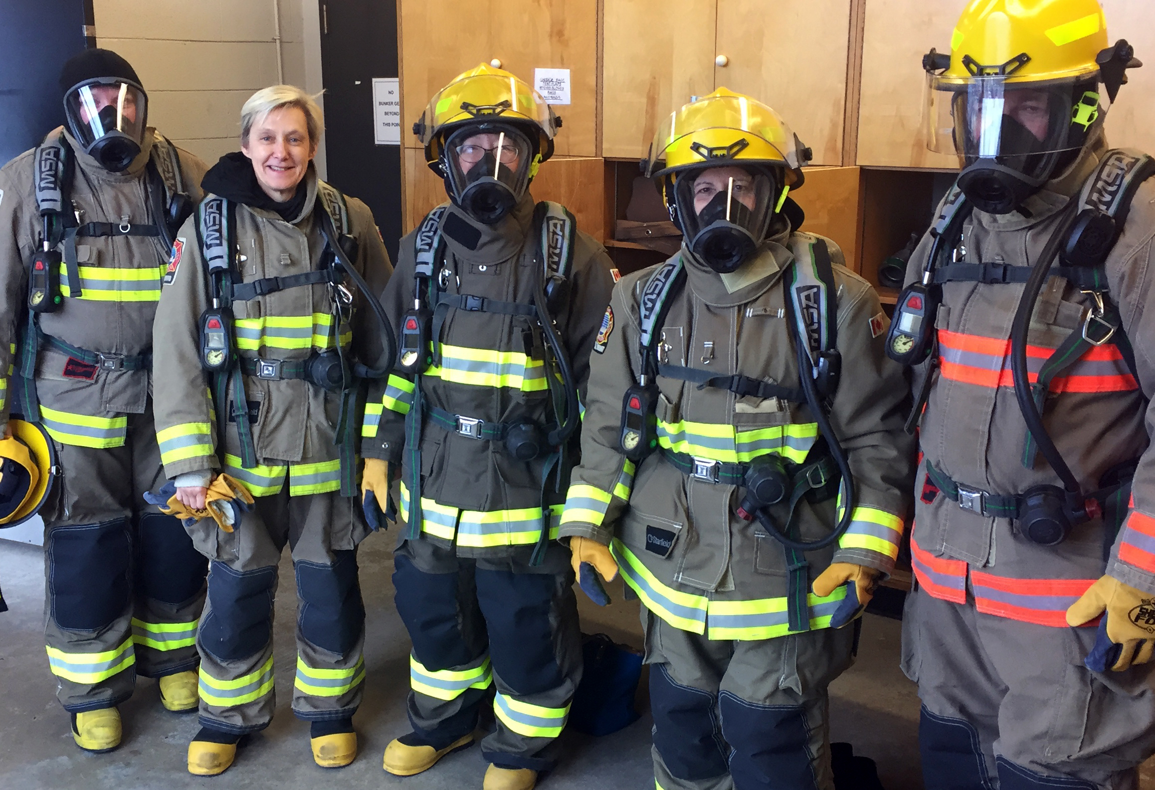 City Clerk Ulli Watkiss (unmasked) and members of the senior management team took part in a firefighting training exercise during an extended management team session on emergency preparedness.