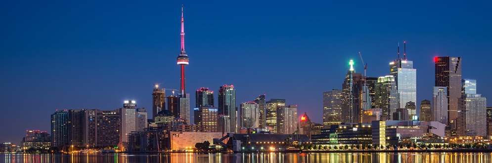 City skyline picture taken from the lake at night