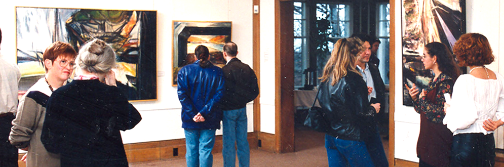 Visitors view art work in the Cedar Ridge Gallery.
