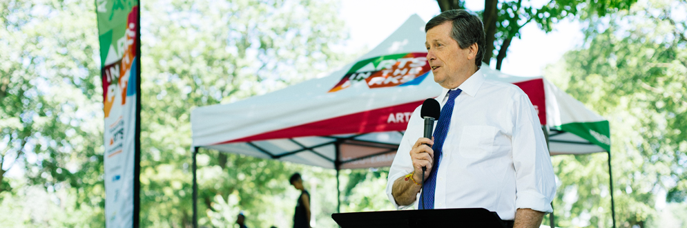 Toronto Mayor John Tory speaking to an audience during an outside event
