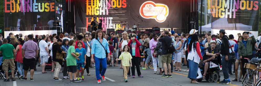 A crowd of people congregating together