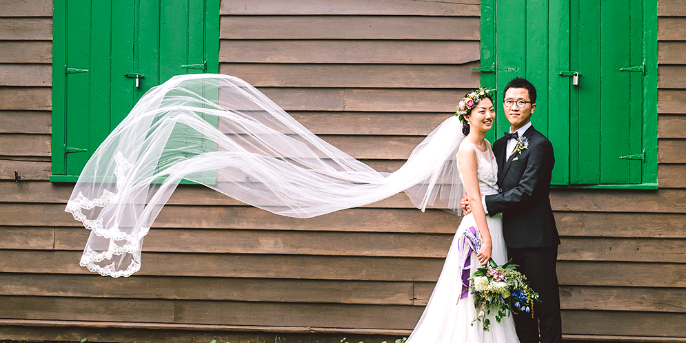 Man and woman posing for wedding picture