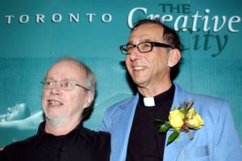Dennis Lee and Pier Giorgio Di Cicco pose for a picture, looking away from the camera
