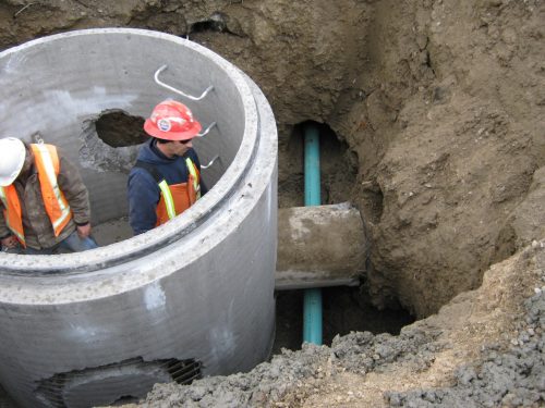 Workers installing new sewer.
