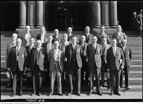 Group of Works Dept. staff on steps of Old City Hall, prior to Vimy pilgrimage