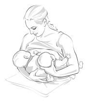 woman holding 2 babies one in cradle and one in football hold