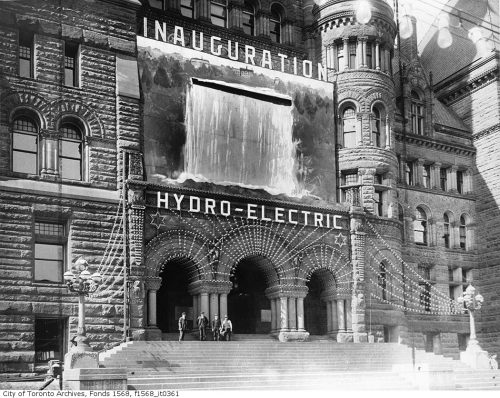 Old City Hall with a large banner on it showing a waterfall.