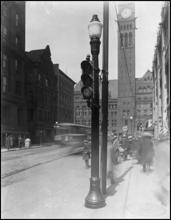 Lamp post with traffic lights attached. Old City Hall is in the background.