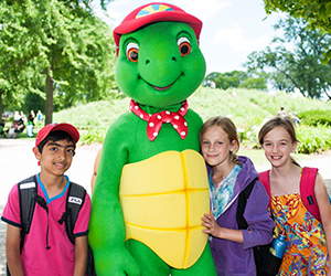 Children posing with Franklin the Turtle