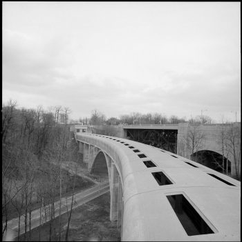 Covered concrete bridge with slits in the roof.