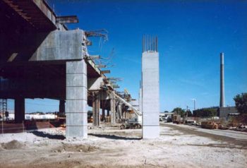 New columns standing beside old elevated expressway