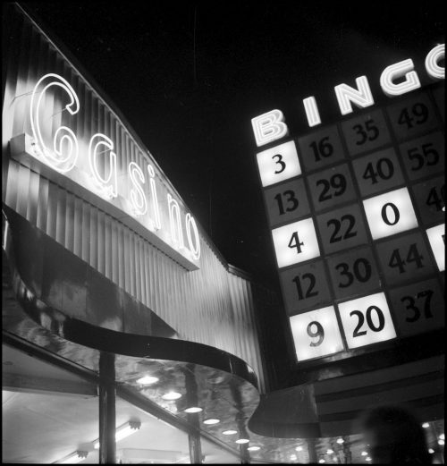 Neon signs saying Casino and Bingo. One looks like a bingo card.