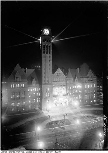 Front of Old City Hall with all the lights on the clock tower illuminated.