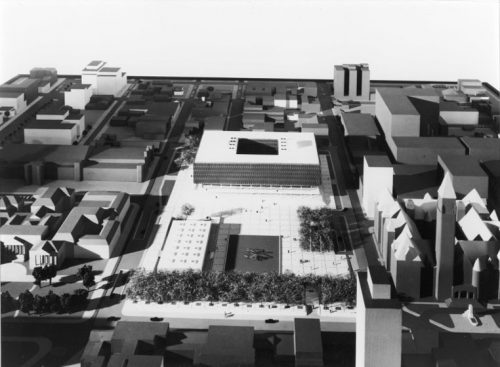 Model of large square building with hole in centre