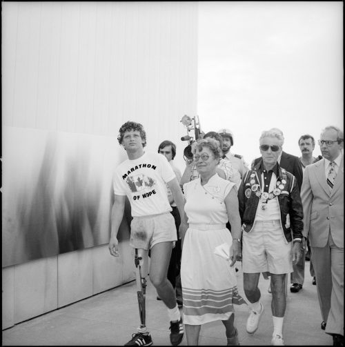 A picture of Terry Fox walking with Alderman Eidt and Mayor Harris