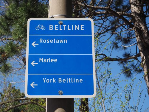 Photograph of a large wayfinding sign directing cyclists to nearby roads and trails