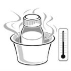 bottle of breastmilk inside of a cup of hot water
