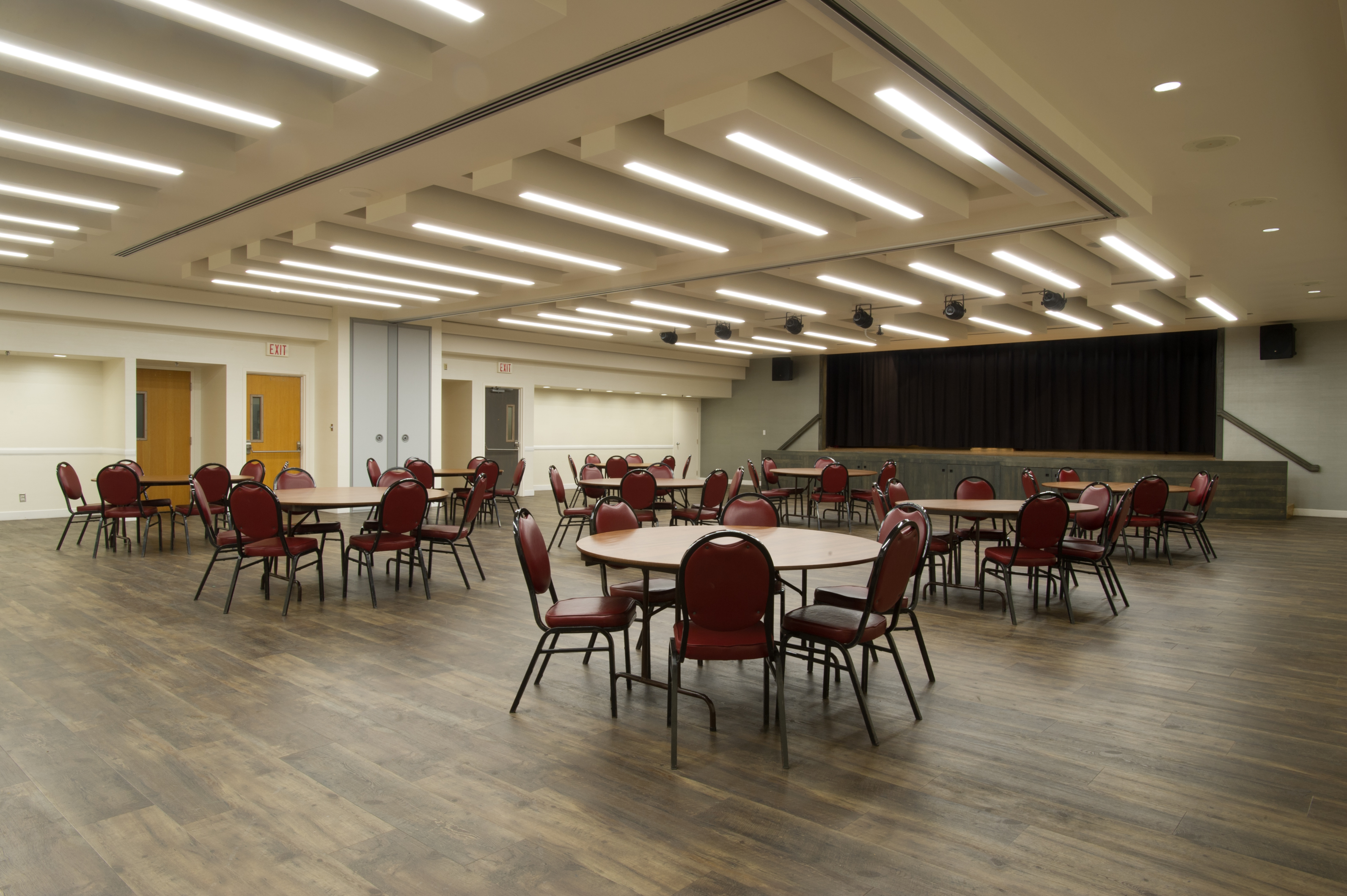 Memorial Hall Burgundy Room with a round tables setup throughout the room