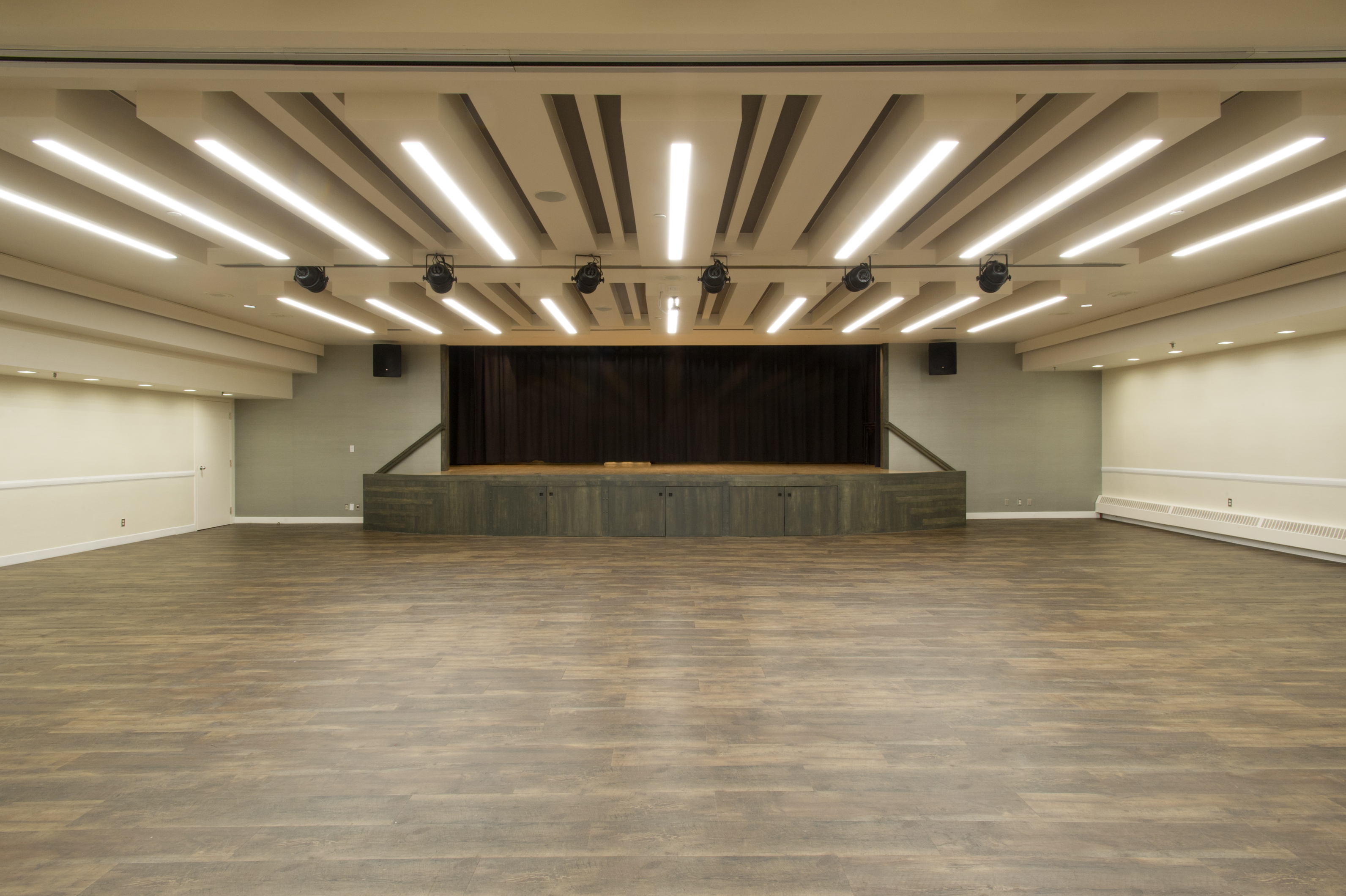 View of an empty Burgundy Room and stage at Memorial Hall.