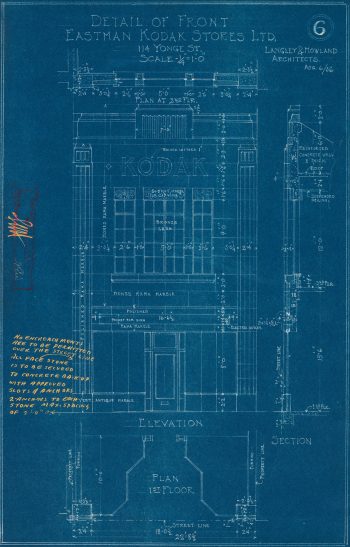 Blueprint of two-storey building with tall windows on the second floor and a sign reading "Kodak".