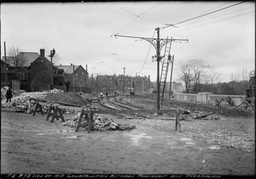 Construction of streetcar tracks and streetcar power line support.