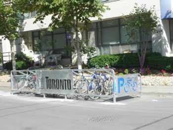 A newer ‘parking stall’ design bicycle corral that is enclosed on three sides