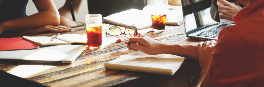 People at a meeting with coffee