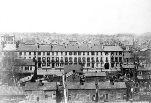 Looking from a high place over row houses and small wooden semi-detached houses