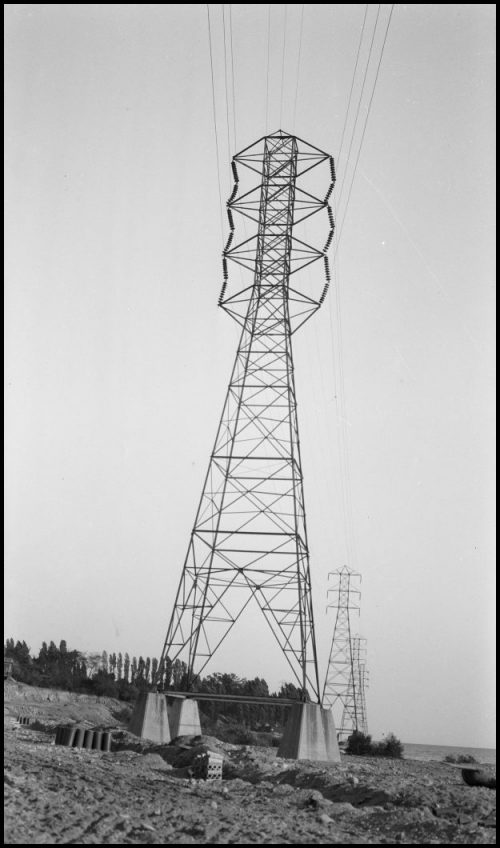 Tall metal hydro wire transmission tower.