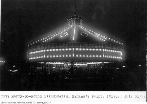 Round canopy with lights around the rim and up to the pointed roof.