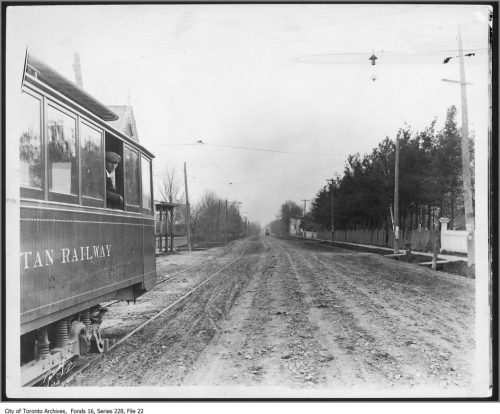 streetcar on tracks on a dirt road