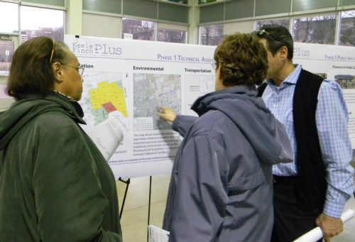 People pointing to a map during the March 2017 Open House portion of the Keele Finch Plus March 2017 meeting.