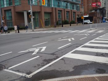 Cycle track chevrons show cyclists and drivers the route cyclists should take through the intersection