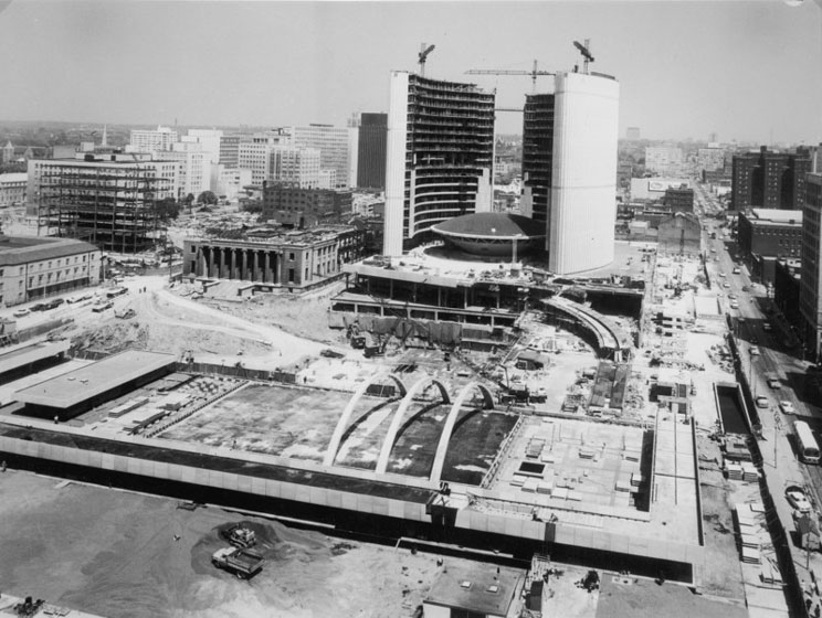 City Hall and Nathan Phillips Square under construction as seen from the air from the south, towers mostly completed