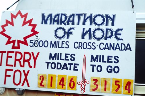 Picture of Terry Fox Marathon of Hope banner stating how many miles he ran (2146) and how far he has to go (3154)