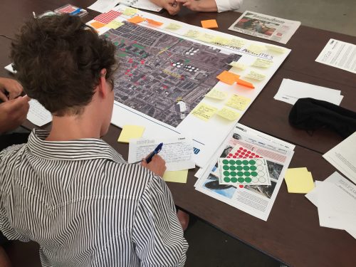 Photo of someone writing comments down at the June 2016 Keele Finch Plus consultation.