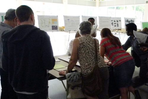 Photo of attendees working at a table at the June 2016 Keele Finch Plus consultation.
