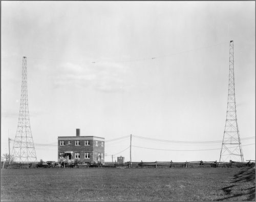 Radio transmitters next to brick building