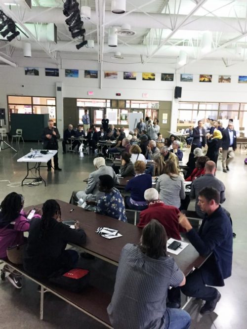 Photo of Councillor Perruzza giving opening remarks at the September 28, 2017 public meeting to an audience.