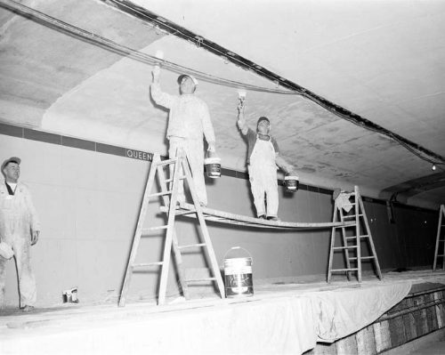 Painting ceiling in Queen station