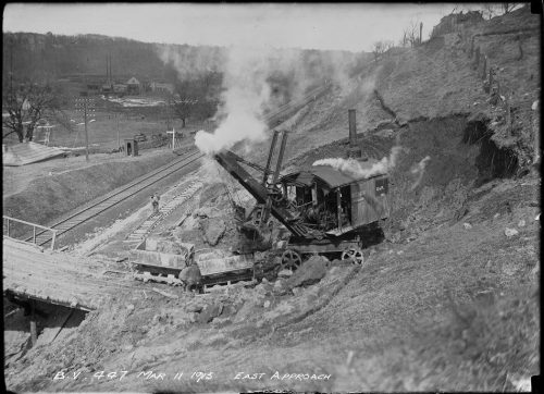 Looking over valley with steamshovel in foreground.