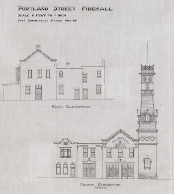 Both sides of fire hall showing tower and large double doors.