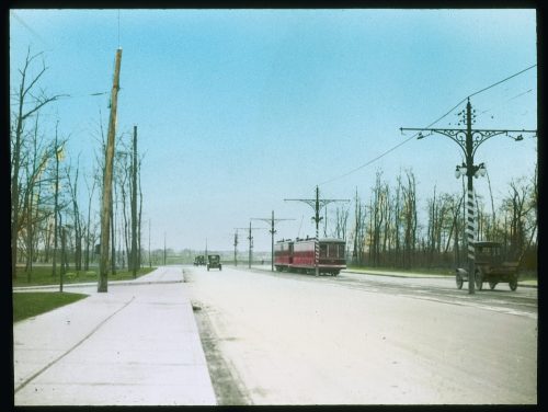 Streetcar on roadbed of viaduct.