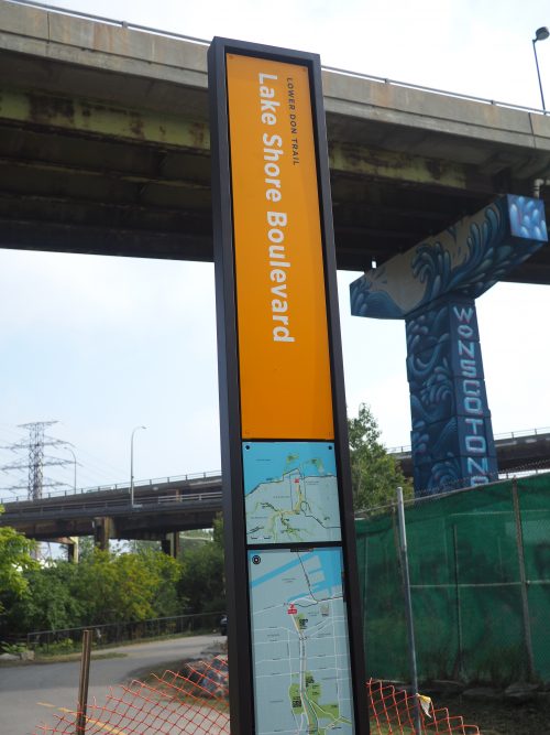 Photograph of orange signage on the Lower Don Trail 