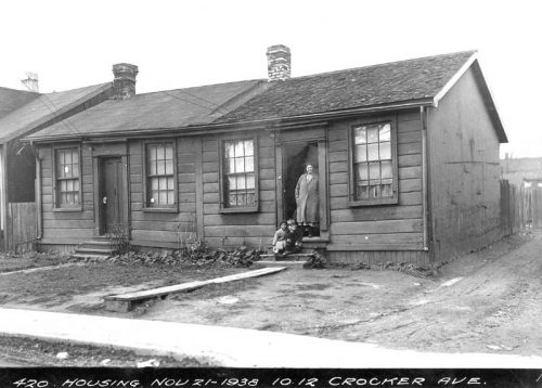 Small one-storey wooden row houses in poor condition