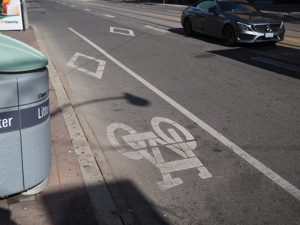 Painted bike lane on Bay St north of Dundas St W