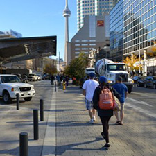 Image of pedestrians walking on Front Street