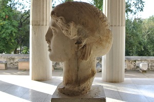 A photo of a statue from the neck up.