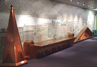 Image of the mosaic (by Brian Kipping and John McKinnon) on the second floor of Toronto City Hall that is made up of copper and glass mosaic tiles to present a rooftop panoramic view to the east and west from the roof of City Hall.
