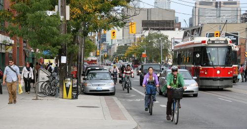 Image of College street showing motorists, transit users, cyclists and pedestrians, and supports vibrant commercial zones